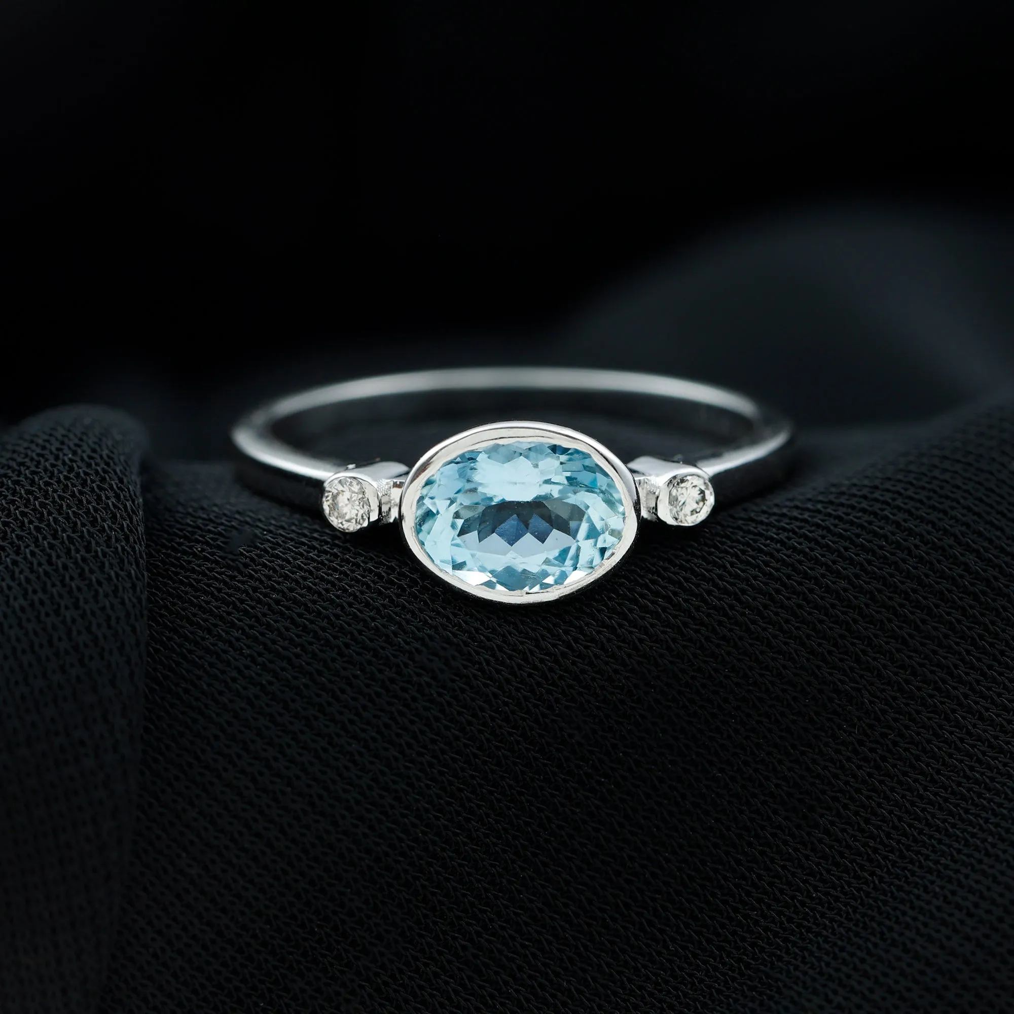 Bezel Set Aquamarine and Diamond East West Engagement Ring