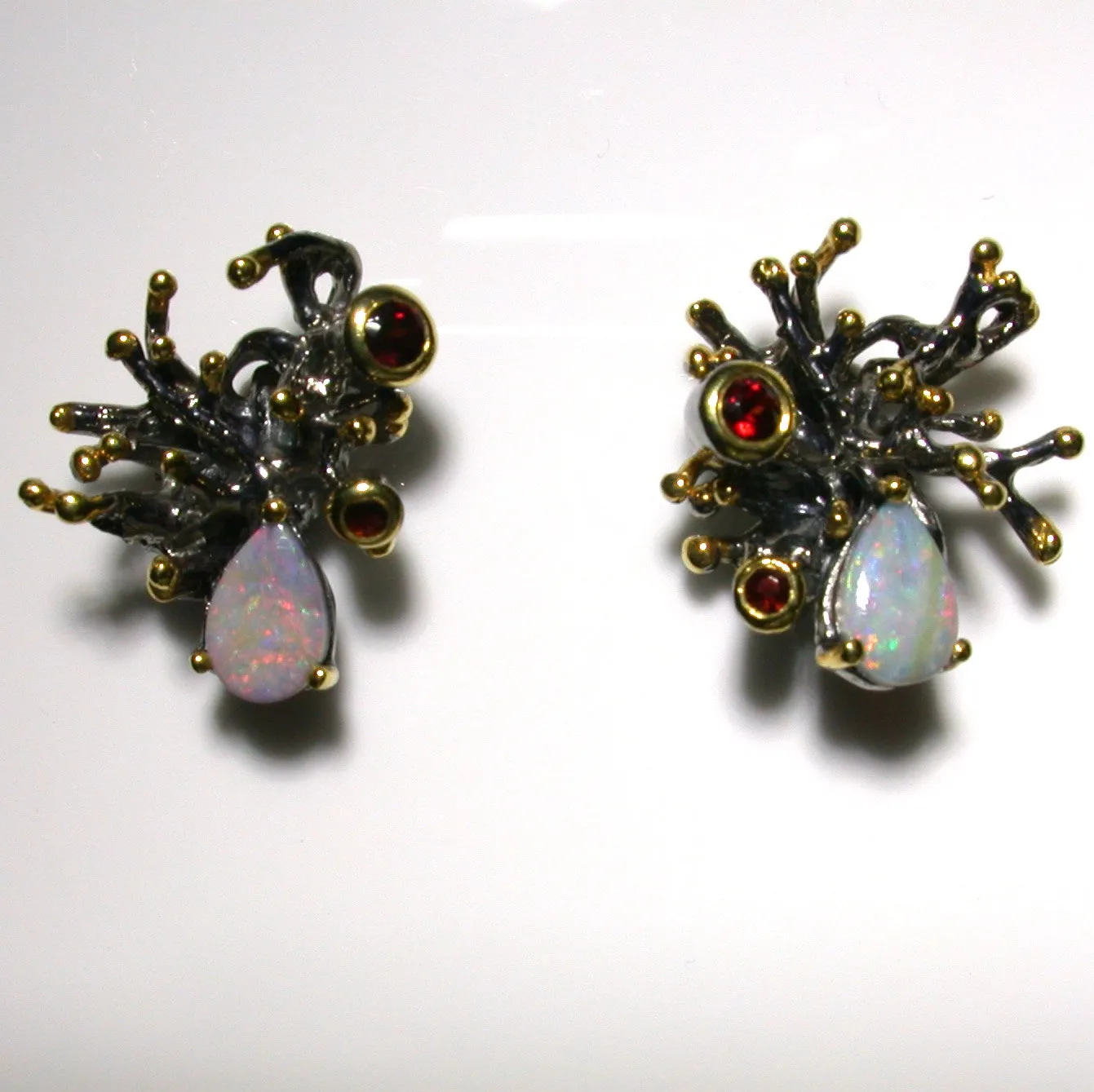 Pink and green solid boulder opals and garnets set in sterling silver stud earrings